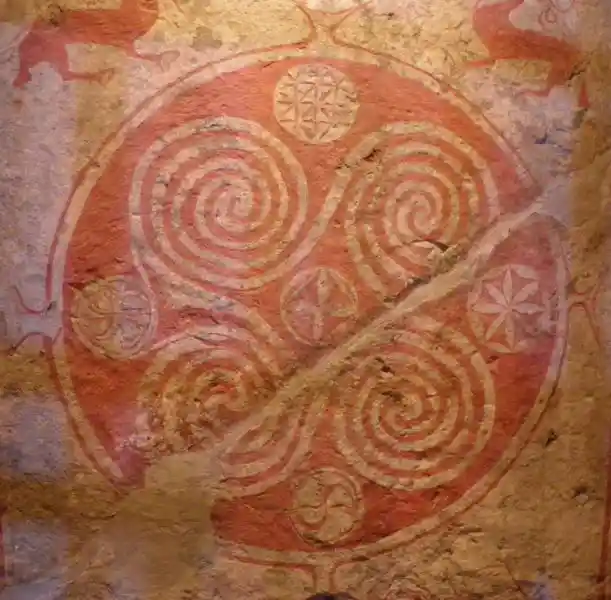 Rounded swastikas with spiral edges inside a circle